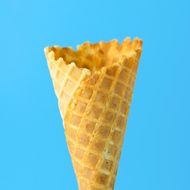 Ice cream cone in front of cyan background
